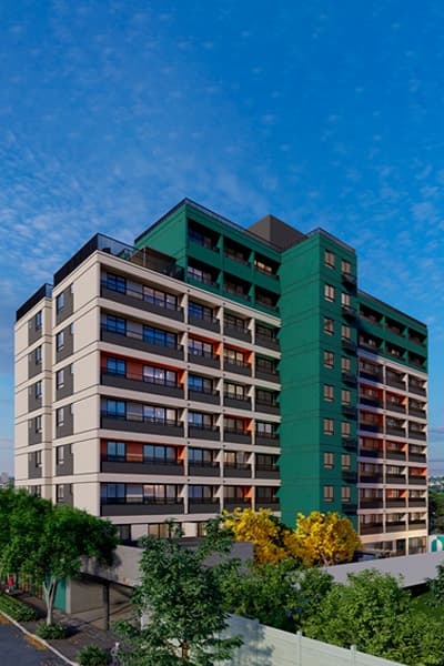 Fachada externa de edifício com detalhes em verde e bege.